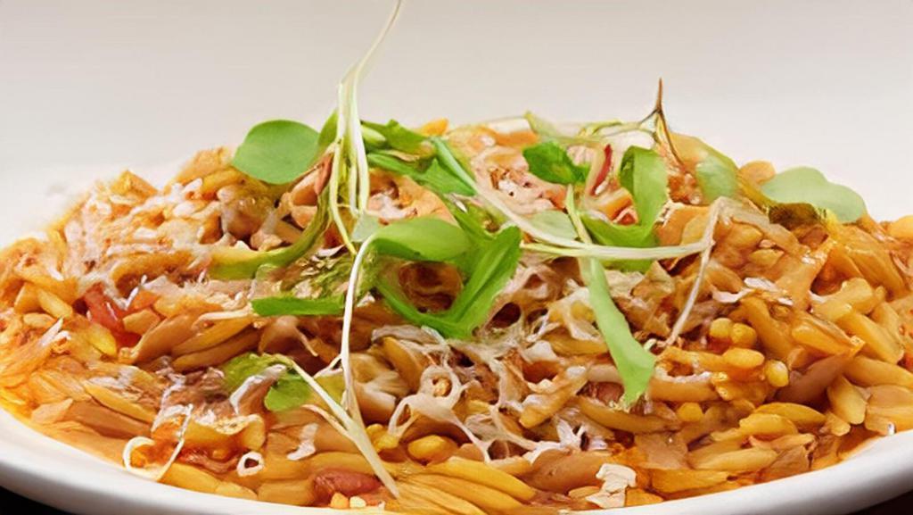 Orzo · Large rice shaped pasta tossed with fresh tomato sauce and grated kefalotyri cheese.