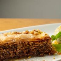 Baklava · Layered  pastry dessert made of phyllo pastry filled with chopped walnuts, almonds and pista...