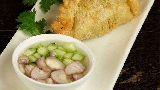 Curry Puff · Minced chicken and potatoes with sweet cucumber sauce.