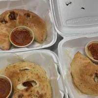Turkey Calzone · Sliced turkey breast red onions and tomato with our cheese blend.