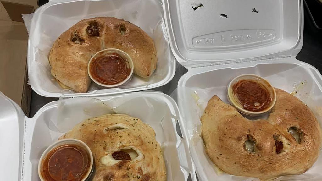 Turkey Calzone · Sliced turkey breast red onions and tomato with our cheese blend.