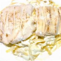 Fettuccine Alfredo With Grilled Chicken · Grilled chicken strips over fettuccine pasta in a creamy alfredo sauce topped with grated Pa...