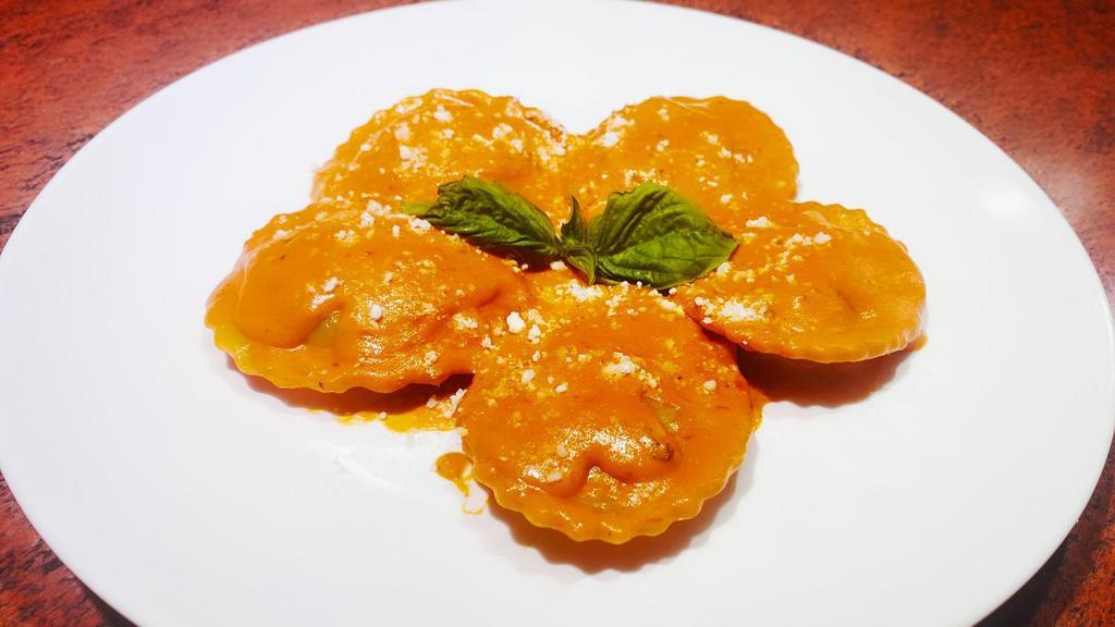 Lobster Ravioli · Pasta filled with lobster meat, topped with creamy vodka sauce and grated Parmesan cheese.