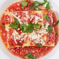 Baked Manicotti · Pasta stuffed with ricotta and Parmesan cheese, fresh tomato sauce topped with melted mozzar...