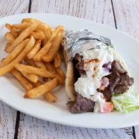 Classic  Greek Gyro · Gyro Meat ,  wrapped with  Lettuce ,Tomato and Onion , on a Pita  with
Tzatziki on the Side....