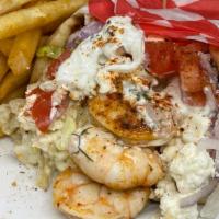 Mykonos Gyro · Seasoned Grilled Shrimp, Feta, Lettuce, Tomato, Onion & Tzatziki Sauce on a Toasted Pita, se...