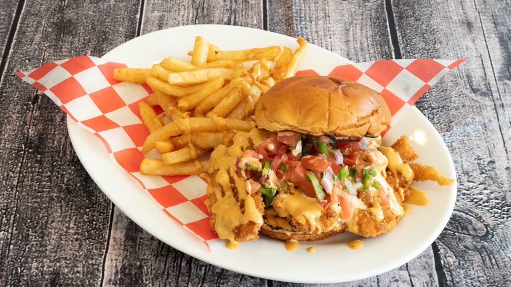 Bang Bang Crispy Chicken · Crispy Fried Chicken Breast topped with Pico de Gallo and Sweet & Spicy Cream Sauce on a Brioche Bun.