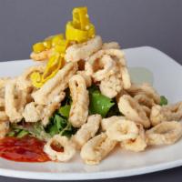 Crispy Calamari · Pepperoncini, wasabi aioli, thai chili and marinara dipping sauces.
