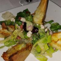 Spanakopita · Phyllo pastry, spinach, feta cheese with Greek salad.