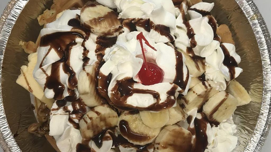 Waffle Sundae · Two scoops of ice cream, walnut whipped cream and touch with chocolate syrup.