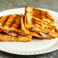 Chicken Cutlet Panini · Chicken cutlet, bacon, melted American cheese and Russian dressing.