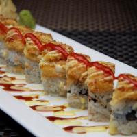 Brooklyn Roll · (Cooked) Snow crab, shrimp, avocado, crunch, topped with white fish served with homemade hot...
