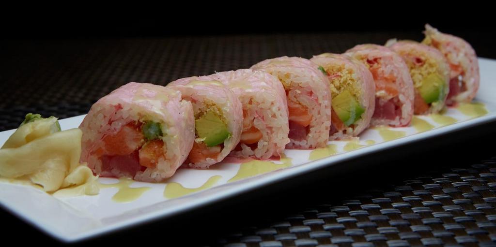Holiday Roll · Tuna, salmon, avocado, masago, crunch wrapped in soy paper, served with sauce of sesame, jalapeno and honey wasabi.