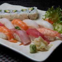 Sushi Deluxe · Nine pieces of assorted sushi and one California roll. Served with miso soup or green salad.