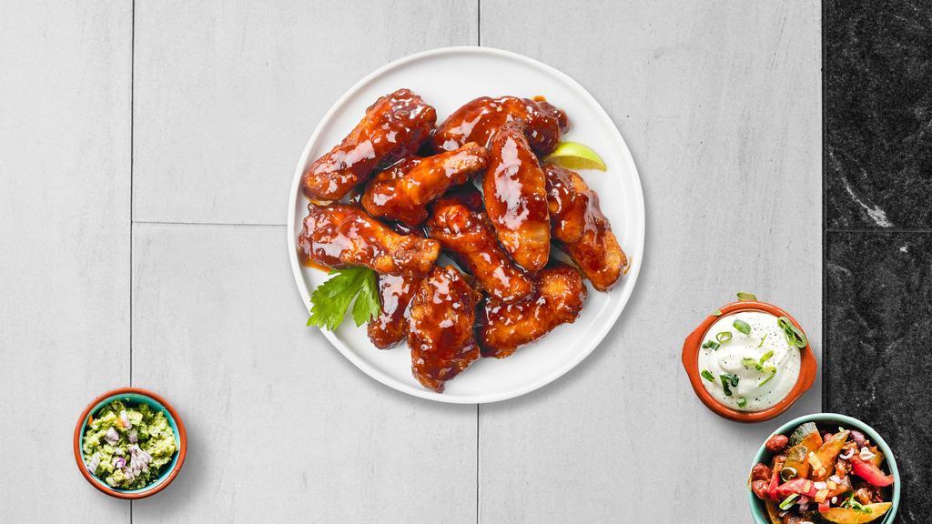 Bbq Chicken Of A Wings · Fresh chicken wings breaded, fried until golden brown, and tossed in barbecue sauce. Served with a side of ranch or bleu cheese.