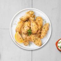 Garlic Parmesan Pretender Wings · Fresh chicken wings breaded, fried until golden brown, and tossed in garlic and parmesan. Se...