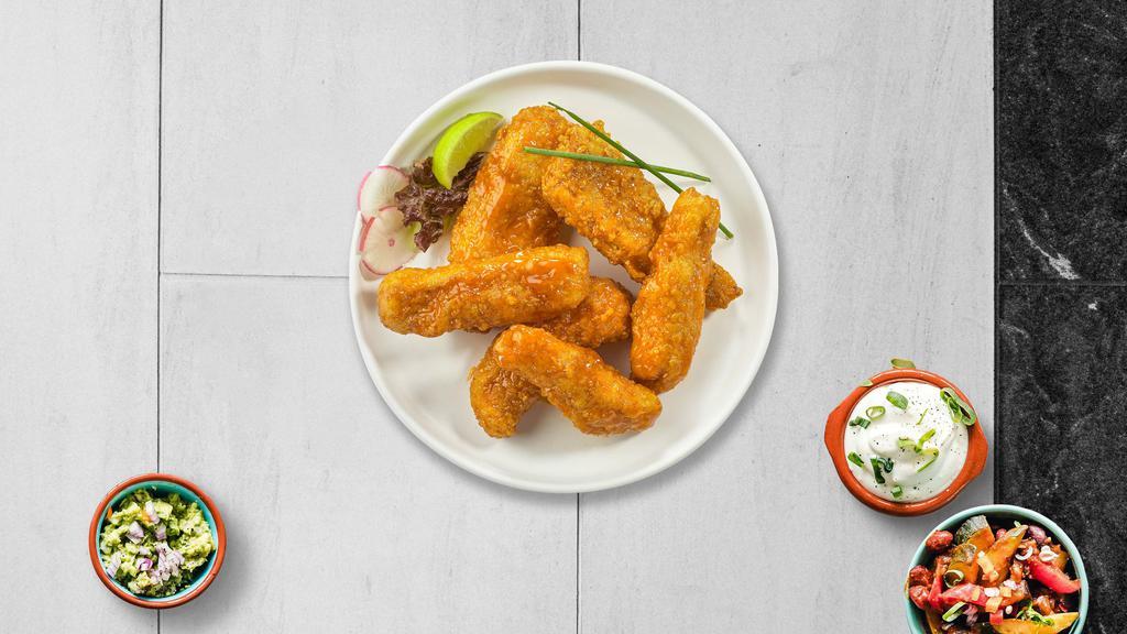 Buffalo Springfield Tenders · Chicken tenders breaded and fried until golden brown before being tossed in buffalo sauce.