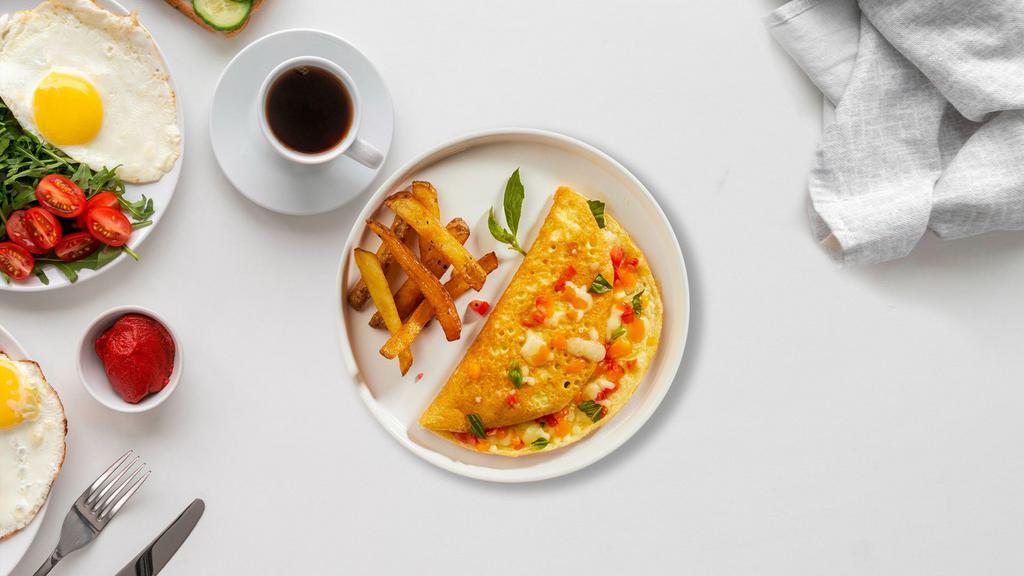 Western Omelette · Eggs cooked with turkey ham, onions, and pepper as an omelette. Served with toast and home fries.