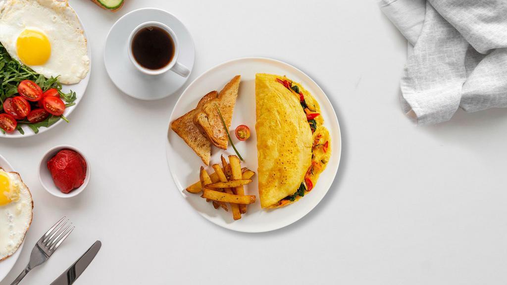 Very Veggie Omelette · Eggs cooked with tomatoes, onions, mushrooms, peppers, and broccoli.  Served with toast and home fries.