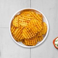 Waffle Fries · Idaho potatos sliced in an alternating waffle pattern, fried until golden brown, and garnish...