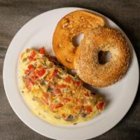 California Veggie Omelet · Three- egg omelet with cheese, sautéed tomatoes, peppers, onions and choice of bread.