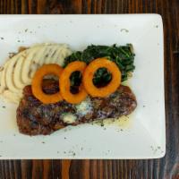 New York Strip Steak · (Dry Aged  Angus Beef)   
Garlic Smashed Potatoes, Sautéed Spinach, Onion Rings, 
Herb Butter
