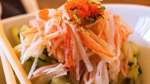 Spicy Kani Salad · Crab stick (contains gluten), cucumber, masago (contains gluten), and tempura flakes (contains gluten).