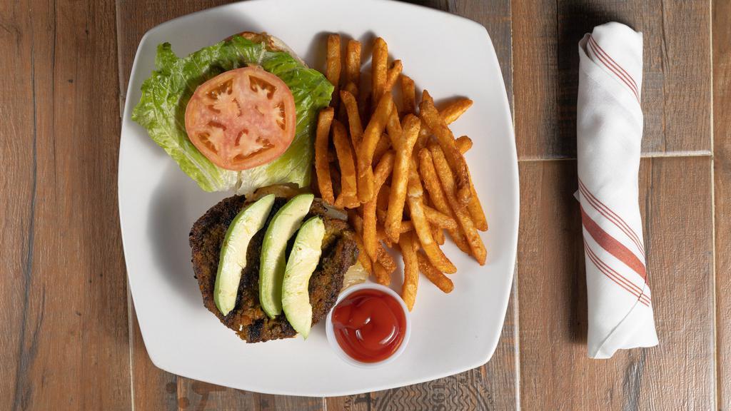 Hush Veggie Burger · Plant based patty, marinated balsamic grilled bell peppers, sun dried tomato, grilled red onions, lettuce w/avocado, drizzled w/garlic remoulade sauce