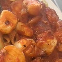 Seafood Fra Diavlo · Shrimp, mussels, and scallops in spicy tomato sauce served over linguini.