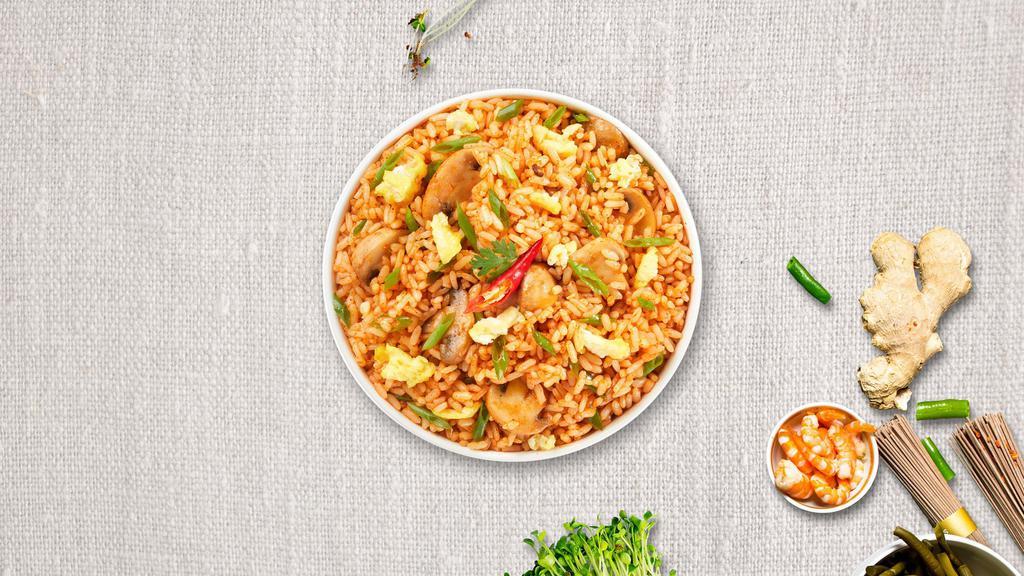 Tom Yum Me · Stir fried rice with egg, mushroom, scallions, onions, bell pepper and lemongrass. Spicy.
