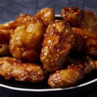 Hawaiian Garlic Chicken Wings · 10 pieces of golden chicken wings glazed with a sweet savory glaze.