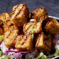 Crispy Garlic Tofu · Indulgent crispy tofu pan-fried with a pineapple garlic soy, sprinkled with sesame seeds ove...