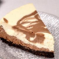 Nutella Cheesecake Slice · Nutella marble cheesecake with Oreo crust