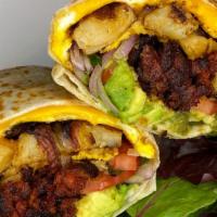 Breakfast Burrito · Burrito filled with eggs, chorizo, cheese, avocado, onions, potatoes, tomatoes.