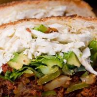Milanesa Cemitas · Puebla style sesame seed bun sandwich with breaded beef. Lettuce, tomatoes, onions, avocado,...