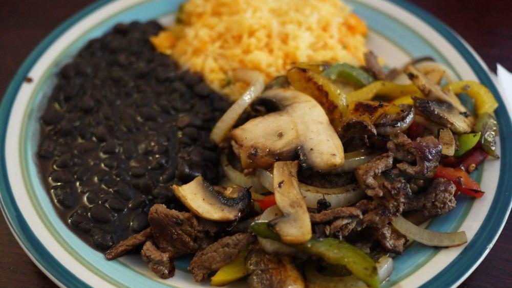 Fajitas · Your choice of meat sauteed with mix bell peppers, mushrooms and onions. Served with rice and beans.