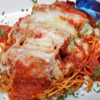 Eggplant Rollatini · Lightly battered eggplant stuffed with ricotta, covered with sauce, & melted mozzarella.