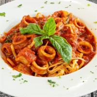 Calamari Marinara · Tender calamari sauteed in our marinara sauce. All entities served over pasta or side of mas...