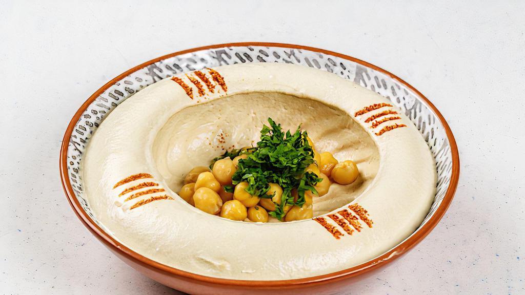 Hummus · Chickpeas, olive oil and squeeze of lemon. Vegan.
served with pita