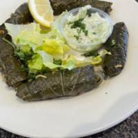Veggie Dolma App · Vegan. Grape leaves stuffed with rice, spices, tomato and parsley