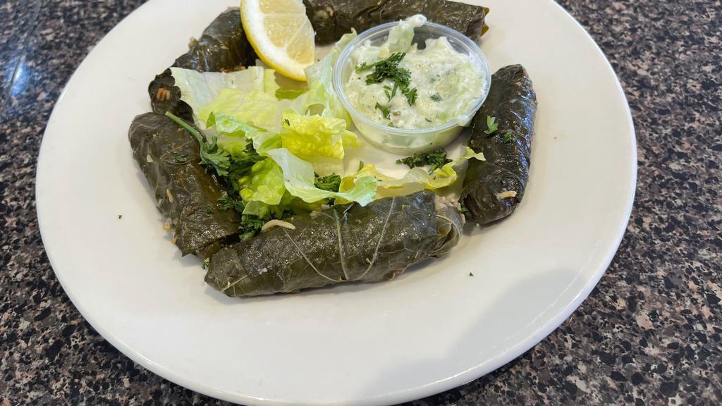 Veggie Dolma App · Vegan. Grape leaves stuffed with rice, spices, tomato and parsley