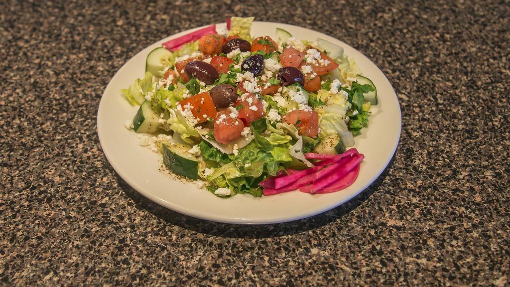Greek Salad (Large) · Romaine lettuce, tomato, cucumber, scallion 
Toppd with cheese and greek dressing