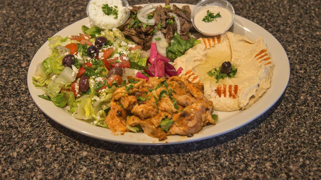 Shawarma Plate · Chicken and beef comes with hummus , Greek salad and pita on the side