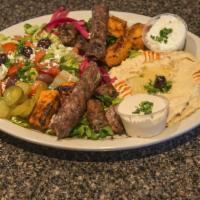 Mashawi Plate · Chicken Kabab , beef Kebab , Kofta Kabab ( ground beef

Comes with Hummus and Greek salad