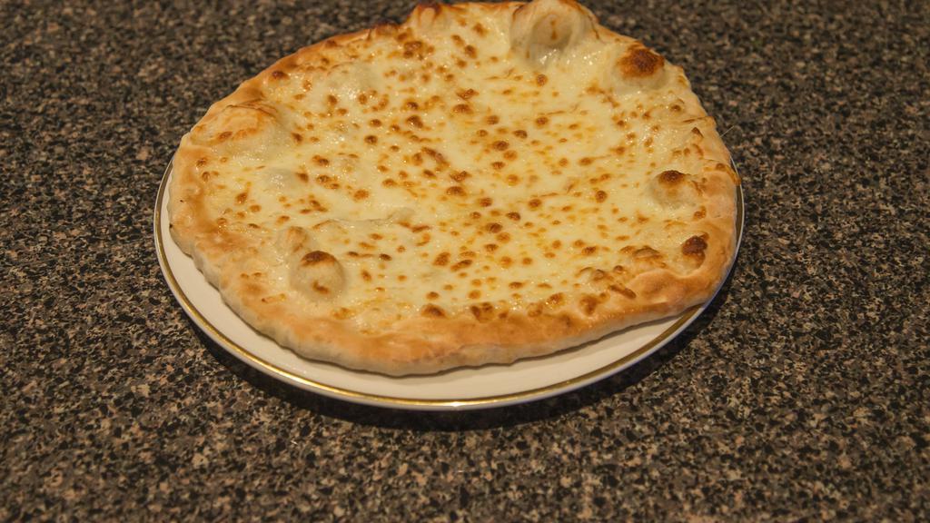 Cheese Manakeesh · flat bread topped with  special cheese  .  served fresh from the oven