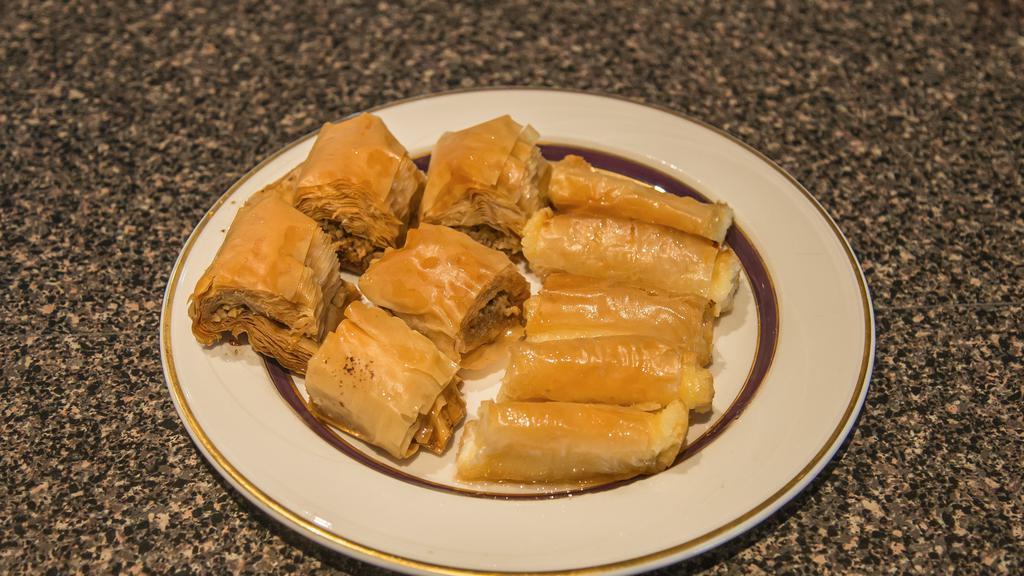 Baklava Large Container  · 8 pieces of Baklava. Layered pastry dessert made of phyllo pastry, filled with chopped walnuts, and sweetened with syrup.