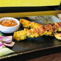 Satay · 5 piece. Marinated on skewers and charcoal grilled to perfection. Served with peanut sauce. ...