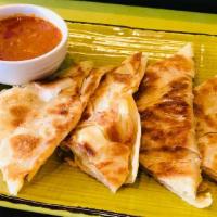 Roti Boom · Indian style pancake served with curry chicken as dipping sauce. Hot and spicy.