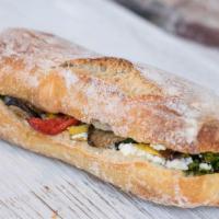 Roasted Veggie Goat Cheese Pistachio Pesto On Focaccia · Delicately roasted summer veggies (zucchini, eggplant, red peppers) with goat cheese and a d...
