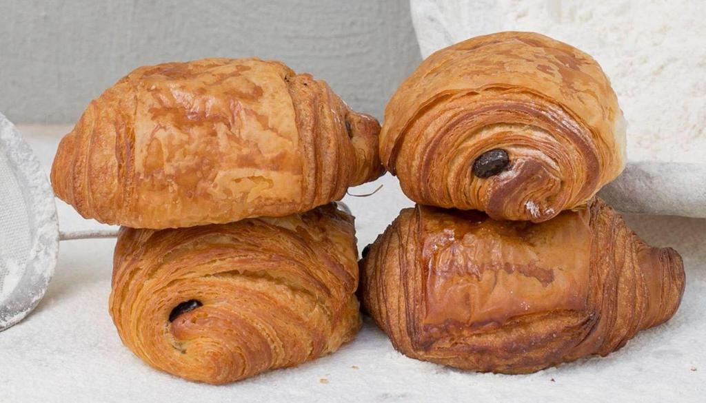 Chocopain · Our best seller!
The namesake of the Bakery/Café, Pain au chocolat (as it is called in France) is made with European butter of the highest quality and two Belgian dark chocolate batons.